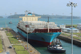 Cargo vessels transit through the Panama Canal, on the outskirts of Panama City