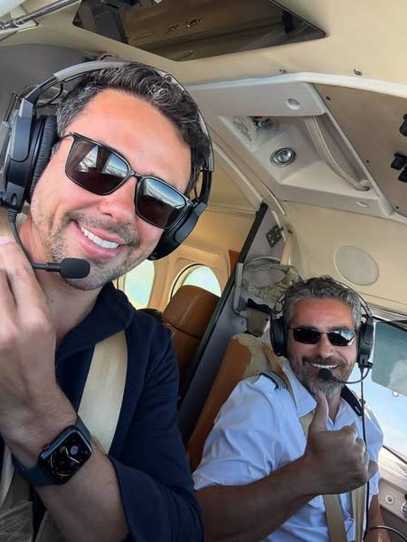 Márcio Carpena e o piloto Gustavo Medeiros