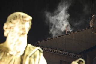 White smoke rises from the chimney above the Sistine Chapel in the Vatican, indicating a new pope has been elected at the Vatican
