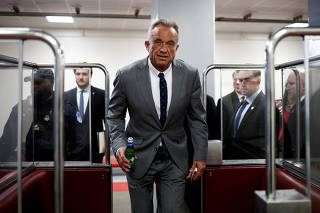 FILE PHOTO: RFK Jr., walks through the Russell Senate Office Building between meetings with senators on Capitol Hill in Washington