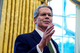 FILE PHOTO: U.S. Secretary of the Treasury Scott Bessent speaks, at the White House