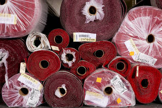 Rolls of the 2025 Oscars red carpet, in an exclusive shade known as Academy Red, arrived at a warehouse in La Mirada, Calif., on Feb. 21, 2025. (Jennelle Fong/The New York Times)