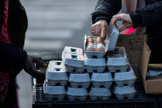 People buy eggs in a local street market at chinatown in New York