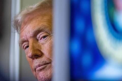 US President Donald Trump speaks to journalists aboard Aire Force One as he travels from West Palm Beach back to Washington on March 9, 2025. (Photo by ROBERTO SCHMIDT / AFP)