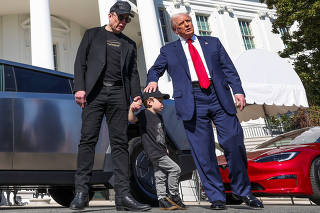 U.S. President Donald Trump views a Tesla car at the White House in Washington