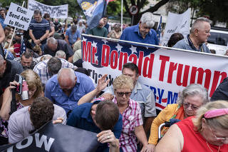 People rallied in support of US President Donald Trump outside the US embassy in Pretoria, South Africa on Feb. 15, 2025. (Joao Silva/The New York Times)
