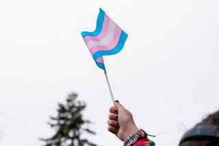 FILE PHOTO: Demonstrators rally in support of trans youth at Seattle Children?s hospital