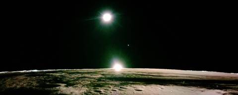 This handout photograph taken by Firefly Aerospace on March 16, 2025 and released on March 18, shows the lunar surface and the setting sun with Earth and Venus on the horizon, during the lunar mission of Firefly's Blue Ghost lunar lander. The private US lander has captured eerie high-definition images of a lunar sunset, which NASA hopes to use to unravel the mystery of a haze first observed on the Moon in the 1960s. (Photo by HANDOUT / Firefly Aerospace / AFP) / RESTRICTED TO EDITORIAL USE - MANDATORY CREDIT 