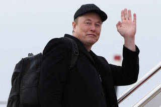 Elon Musk boards Air Force One as he departs for Florida