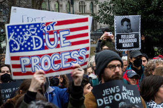 People take part in a rally held by Jewish activists for Freedom and Democracy and against the detention by ICE agents of Palestinian activist and Columbia University graduate student Mahmoud Khalil in New York