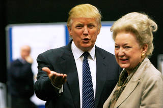 FILE PHOTO: Donald Trump gestures as he stands next to his sister Maryanne Trump Barry, during a break in proceedings of the Aberdeenshire Council inquiry into his plans for a golf resort, Aberdeen