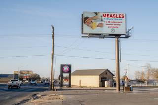 A digital billboard with measles public health messaging by the South Plains Public Health Department in Seminole, Texas, Feb. 24, 2025. (Desiree Rios/The New York Times)