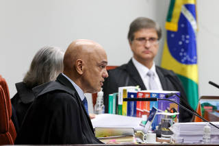 Brazil's former President Bolsonaro attends a session of the Supreme Court as it deliberates if he and some of his closest aides should stand trial for allegedly attempting a coup, in Brasilia