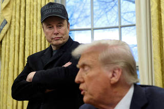FILE PHOTO: Elon Musk and President Donald Trump are shown in the Oval Office