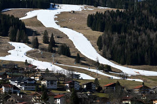 People ski on a layer of artificial snow near the Alpine resort of Lermoos