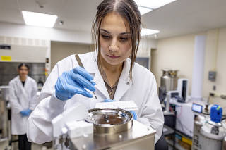 A researcher studies microplastics content in samples at a lab at the University of New Mexico in Albuquerque, March 4, 2025. (Gabriela Campos/The New York Times)