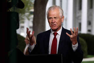 Senior trade adviser Peter Navarro walks, at the White House