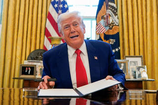 U.S. President Donald Trump signs executive orders at the White House