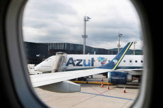 FILE PHOTO: An Embraer PR-AXZ airplane of Azul Brazilian Airlines is seen at Sao Paulo international airport in Guarulhos