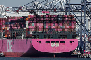 FILE PHOTO: Containers are stacked on the deck of cargo ship One Minato at Port Liberty New York in Staten Island, New York