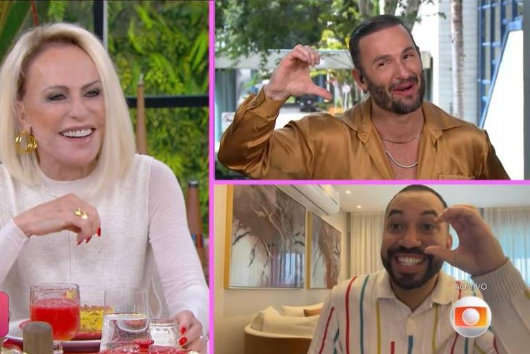 A imagem mostra um programa de TV dividido em três partes. No canto superior esquerdo, uma mulher com cabelo loiro e liso, vestindo uma blusa branca, está sorrindo e segurando um copo com bebida. No canto superior direito, um homem com cabelo curto e barba, vestido com uma camisa dourada, faz um gesto com a mão. Na parte inferior, um homem com cabelo raspado e barba, usando uma camisa listrada, também faz um gesto com a mão e sorri. Ao fundo, há plantas e uma decoração moderna.