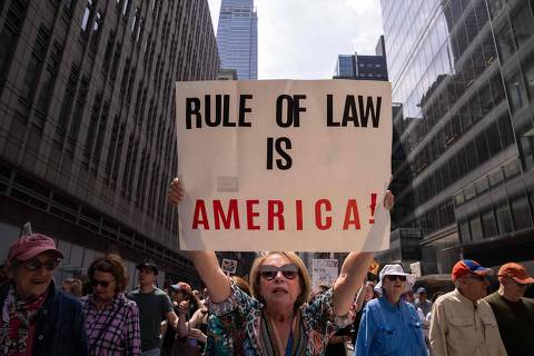 NEW YORK, NEW YORK - APRIL 19: People take part in a protest organised to 'Protect Migrants, Protect the Planet' on April 19, 2025 in New York City. Organizers of the nationwide protest said the demonstrations were to denounce the 