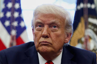 U.S. President Donald Trump signs executive orders in the Oval Office at the White House