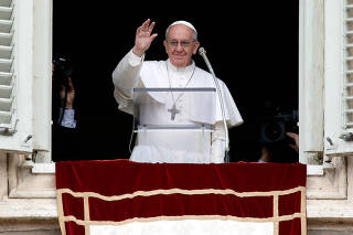 FILE PHOTO: Newly elected Pope Francis appears at the window of his future private apartment to bless faithful during Angelus prayer at Vatican