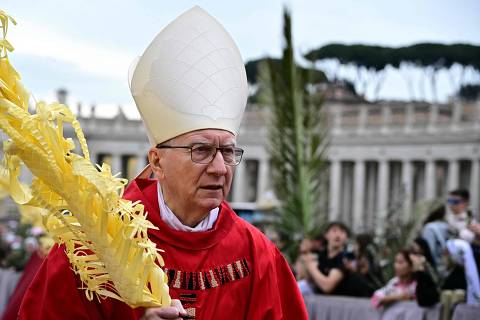 The Vatican's Cardinal Secretary of State Pietro Parolin attends a mass for Palm Sunday in St Peter's square in the Vatican on April 13, 2025. (Photo by Tiziana FABI / AFP)