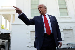 Trump speaks to reporters at the White House in Washington