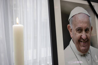 A photograph of Pope Francis is seen at the Apostolic Nunciature, the day that German president Steinmeier signs book of condolences for Pope Francis i
