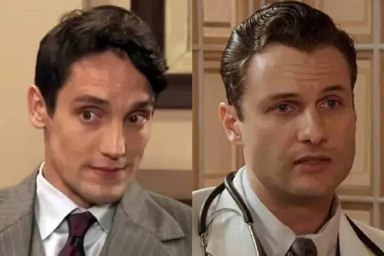 A imagem apresenta dois homens em trajes formais. O homem à esquerda usa um terno cinza com uma gravata de padrão escuro e tem cabelo castanho escuro. O homem à direita está vestido com um jaleco branco sobre uma camisa e gravata, e possui cabelo loiro. Ambos estão em um ambiente interno, com uma decoração neutra ao fundo.