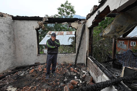 (250508) -- SRINAGAR, May 8, 2025 (Xinhua) -- A man cries in his house that was damaged during skirmishes between the troops of India and Pakistan in Salamabad near Line of Control (LoC), about 110 km north of Srinagar city, the summer capital of Indian-controlled Kashmir, May 8, 2025. (Xinhua/Javed Dar)