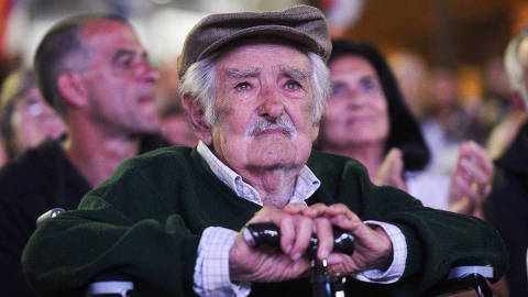 TOPSHOT - Former Uruguayan President Jose Mujica reacts after receiving a tribute during the 54th anniversary of the Frente Amplio political coalition in Montevideo on March 26, 2025. (Photo by Sofia TORRES / AFP)