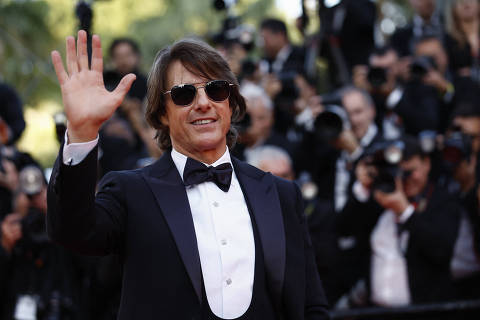 Cast member Tom Cruise poses on the red carpet during arrivals for the screening of the film 