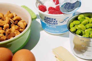 High protein foods such as greek yogurt, edamame, nuts, eggs, and cheese, in New York on May, 9, 2025. (Eric Helgas/The New York Times)