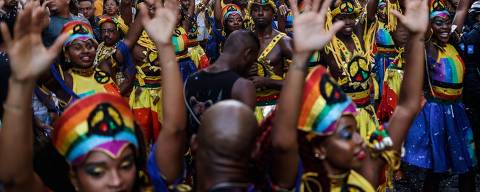 Revelers dance during the Olodum carnival through the streets of Pelourinho, in the historic center of Salvador, Bahia State, Brazil on February 28, 2025. (Photo by Rafael Martins / AFP)
