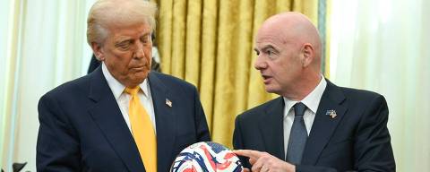 FIFA president (Fédération Internationale de Football Association) Gianni Infantino presents US President Donald Trump with the new FIFA Club World Cup official ball in the Oval office of the White House, in Washington, DC, on March 7, 2025. (Photo by Jim WATSON / AFP)