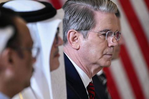US Secretary of Treasury Scott Bessent (R) attends a breakfast with business leaders in Doha on May 15, 2025. (Photo by Brendan SMIALOWSKI / AFP)