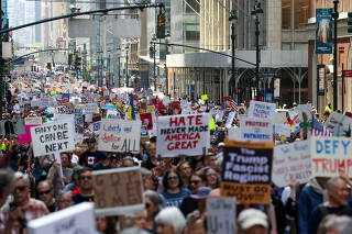 People march to ?Protect Migrants, Protect the Planet? in New York