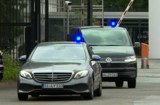 A convoy of police cars leaves the German Federal Public Prosecutor in Karlsruhe