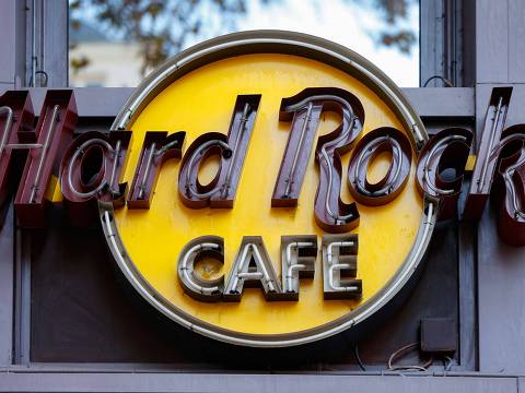 This photograph taken on November 20, 2024 shows signage of the Hard Rock Cafe in Paris. The last Hard Rock Cafe in France, located in the heart of Paris' 9th arrondissement, is closing its doors after 33 years, citing financial difficulties. (Photo by Ian LANGSDON / AFP)