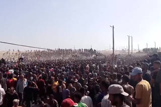 Palestinians rush to get aid boxes, in Rafah
