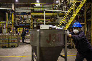 Workers at the Magnequench Company make magnetic powders and products using rare earth metals in Tianjin, China on Oct. 16, 2023. (Sim Chi Yin/The New York Times)