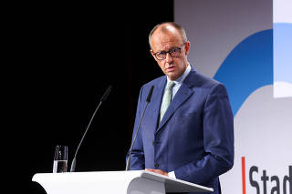 German Chancellor Merz delivers a speech at the German Association of Towns and Municipalities event in Berlin