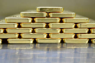 FILE PHOTO: Gold bars and coins in the safe at Pro Aurum gold house in Munich