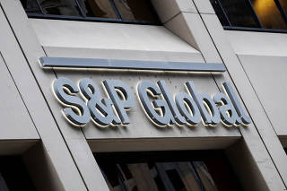 FILE PHOTO: The S&P Global logo is displayed on its offices in the financial district in New York