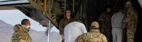 TOPSHOT - This handout picture courtesy of the US Army shows US Transportation Command supports Immigration and Customs Enforcement deportation flights by providing military airlift, Fort Bliss, Texas, on February 10, 2025. Trump administration has begun using military aircraft to underscore its determination to deport undocumented migrants. But while the optics make for good political theatre, the flights are expensive -- as much as $1 million in the case of a recent deportation to India, according to an AFP analysis. (Photo by Sgt. Griffin Payne / US ARMY / AFP) / RESTRICTED TO EDITORIAL USE - MANDATORY CREDIT 