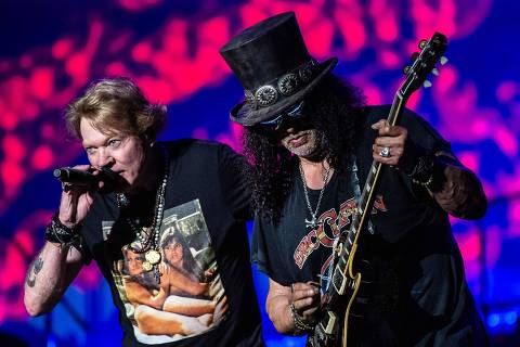 Axl Rose (L), singer of the US hard rock band Guns N' Roses, and lead guitarist Saul Hudson aka Slash perform on Helviti Stage at the Copenhell heavy metal music festival in Copenhagen, Denmark, on June 17, 2023. (Photo by Helle Arensbak / Ritzau Scanpix / AFP) / Denmark OUT ORG XMIT: COP13578 COP13578