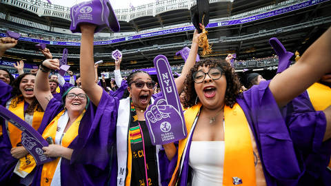 Students celebrate as they attend the New York University (NYU) graduation ceremony at Yankee Stadium in the Bronx borough of New York City,  U.S., May 15, 2025.  REUTERS/Eduardo Munoz ORG XMIT: PPP-EMZ809